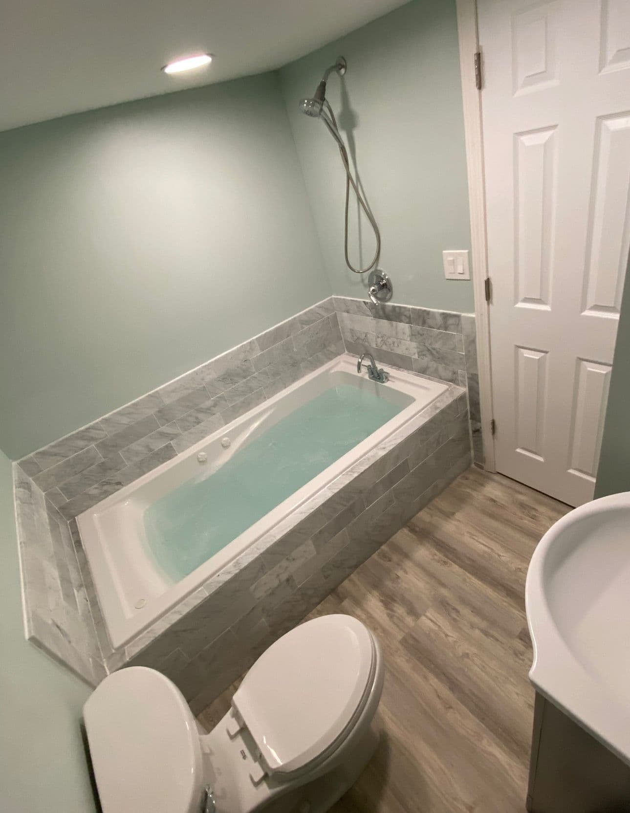 bathroom-remodel-marble-jacuzzi-tub-wood-floor-north-port-fl
