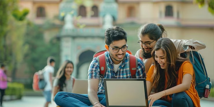 imgi_6_group-students-with-laptop-city-background_972478-17771