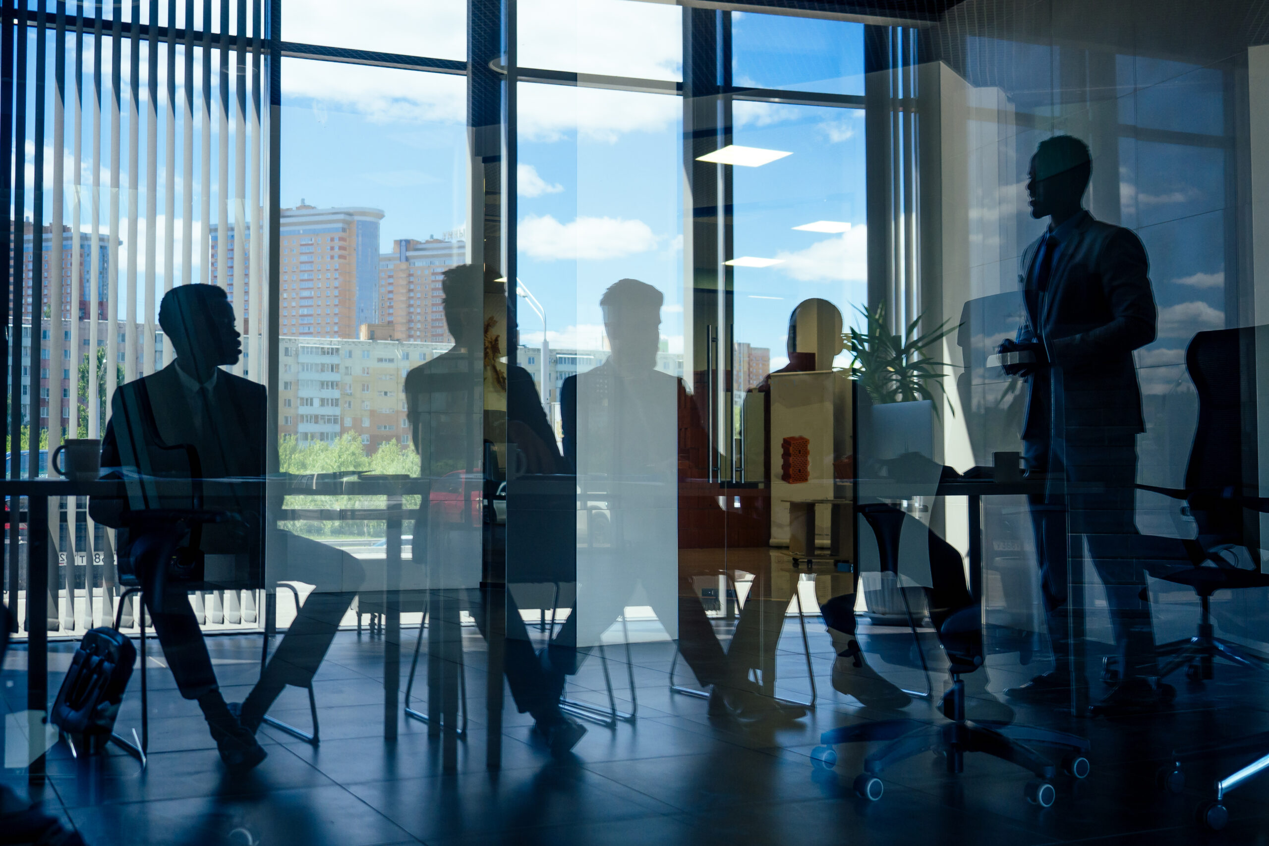 silhouetted-business-team-meeting-in-modern-office-2026-01-05-23-12-19-utc