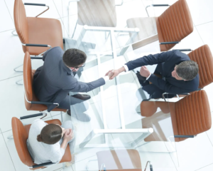 imgi_2_financial-planner-shaking-hands-with-client-aerial-view.jpeg