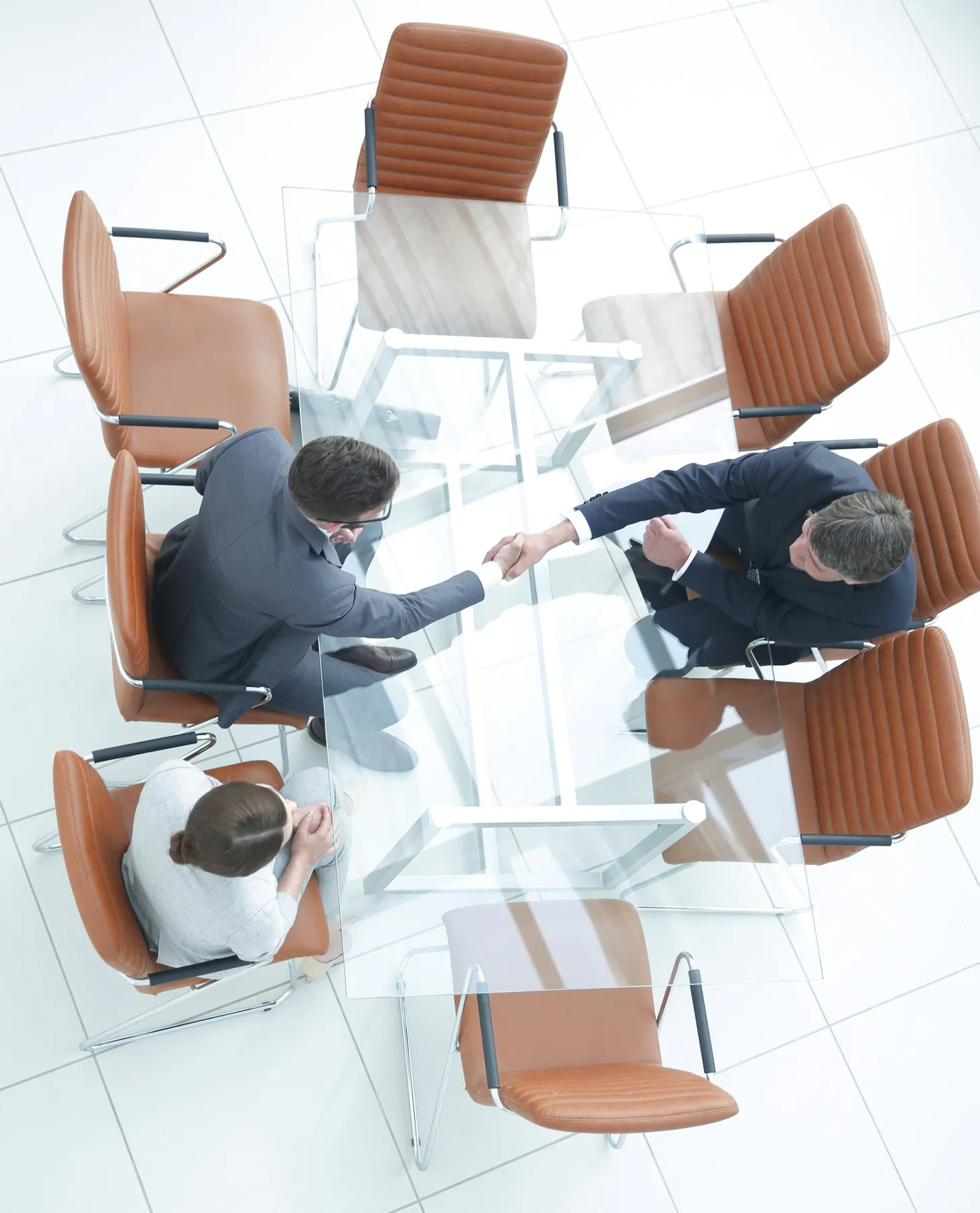 imgi_2_financial-planner-shaking-hands-with-client-aerial-view.jpeg